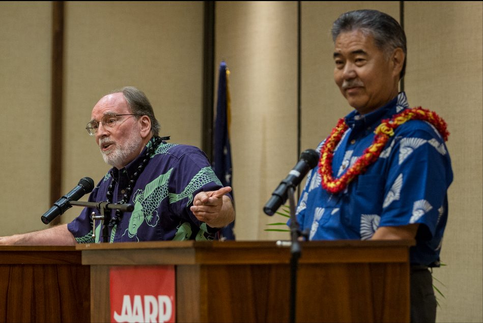 Gov. Neil Abercrombie points to Sen. David Ige during debate presented by AARP at the King Kamehameha Hotel in Kailua-Kona on July 29, 2014