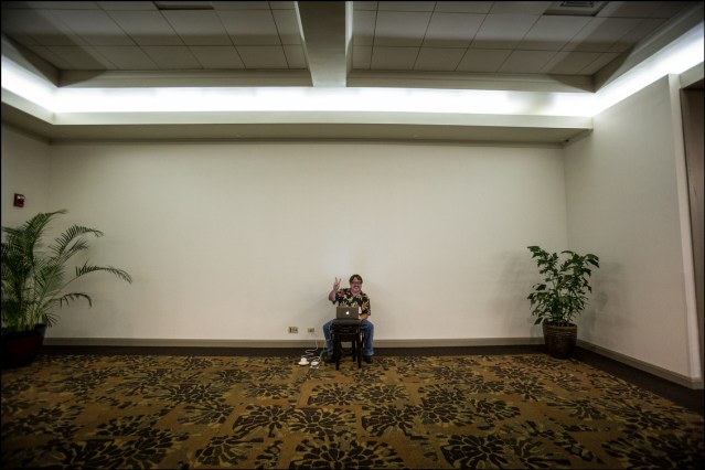 ALONE AGAIN Civil Beat Chief Political Reporter Chad Blair sits alone once again as he covered the Democratic Party Unity Breakfast.  Give him a chair, a cup of coffee and an outlet and he's happy.