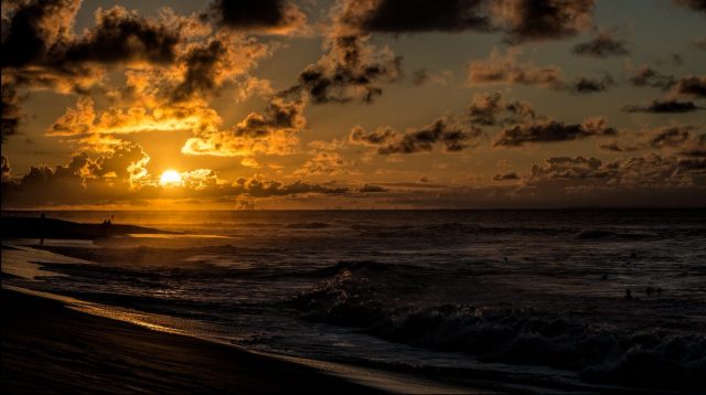 Sunrise on a hot day over Sandy Beach on September 16, 2014