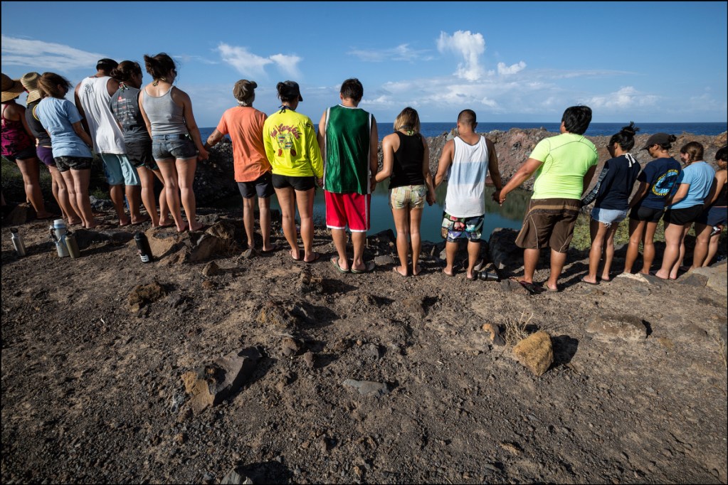 Students from the UH Richardson School of Law say a prayer for Kahoolawe's past and future at Sailor's Hat. 9.30.14