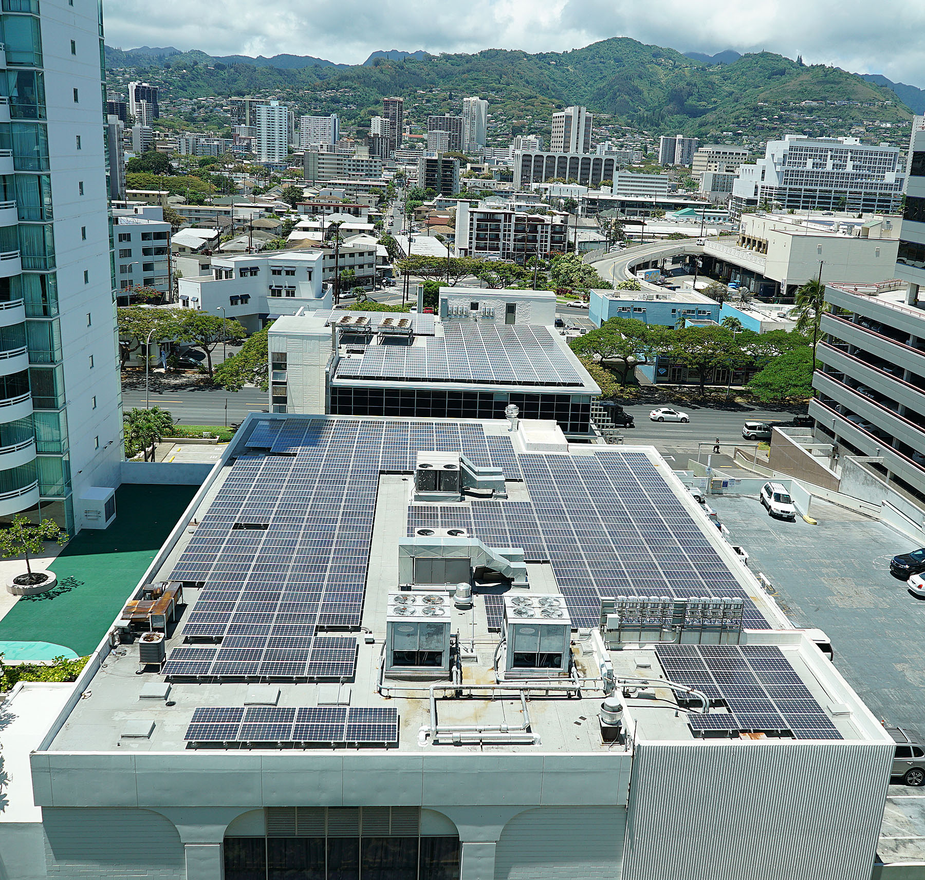 Rooftop solar panels / photovoltaic system installed on adjacent building near Ala Moana Center. 10 june 2015. photograph Cory Lum/CIvil Beat