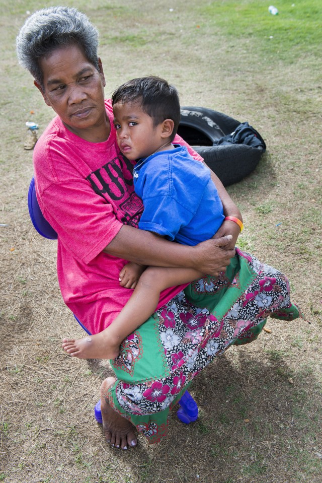 Micronesian immigrants tend to have large families, making it tough for them to find shelter space. This woman and her children found refuge with other families in Kakaako.