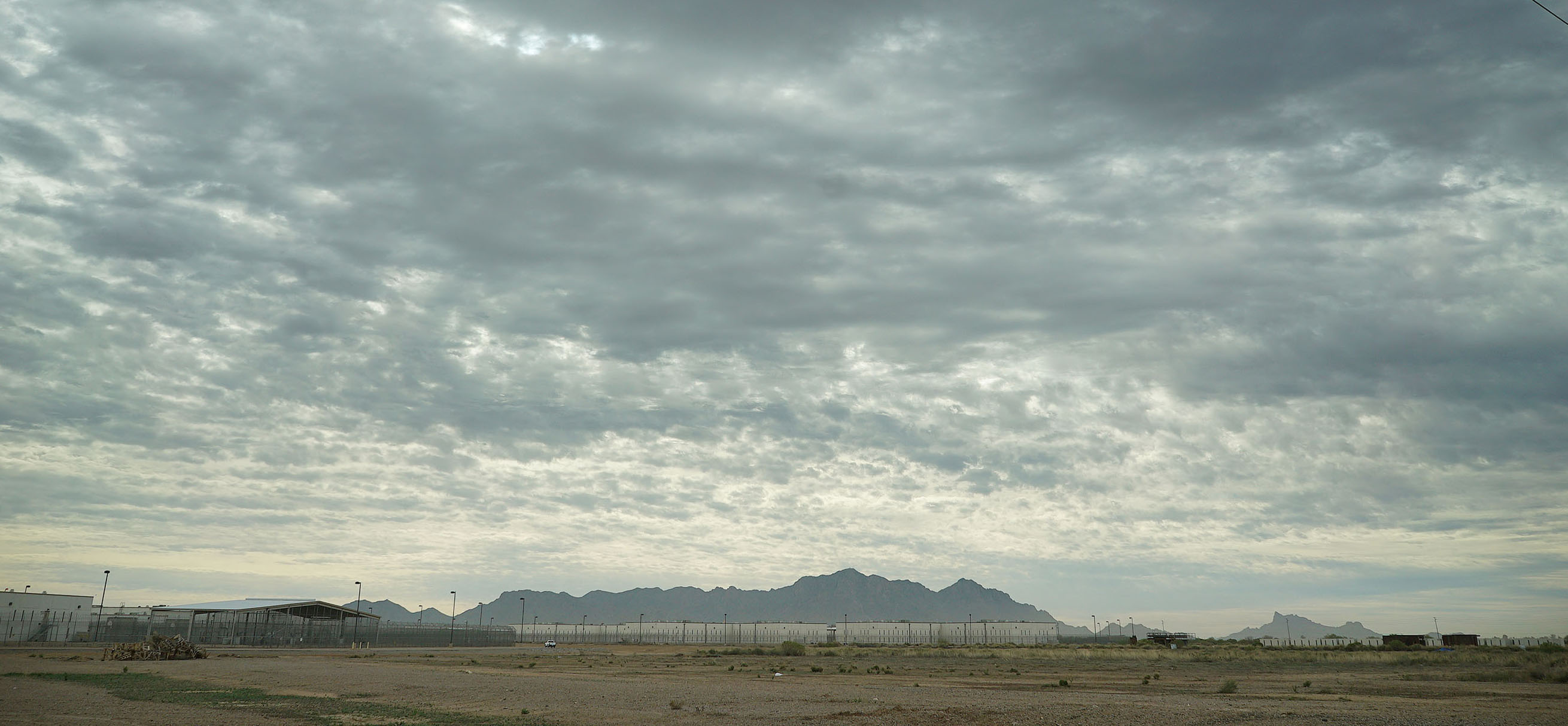 Saguaro Correctional Facility Eloy Arizona clouds and mountain range. 6 march 2016. photograph Cory Lum/Civil beat