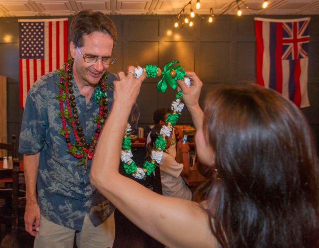 Hawaii Senate District 13 Candidate Karl Rhoads is given a lei while spending time with his supporters at the Square Barrels Craft Burgers and Craft Beers bar Saturday, Aug. 13, 2016, in Honolulu. Photo by Eugene Tanner