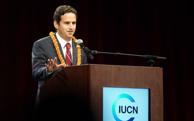 Senator Brian Schatz speaks to attendees at the IUCN opening ceremonies held at the Neal Blaisdell Arena.