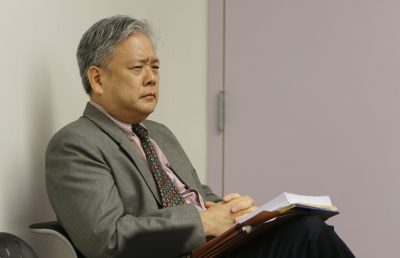 Embattled ex HPD Police Chief attorney Kevin Sumida sits in HPD Police Commission meeting.