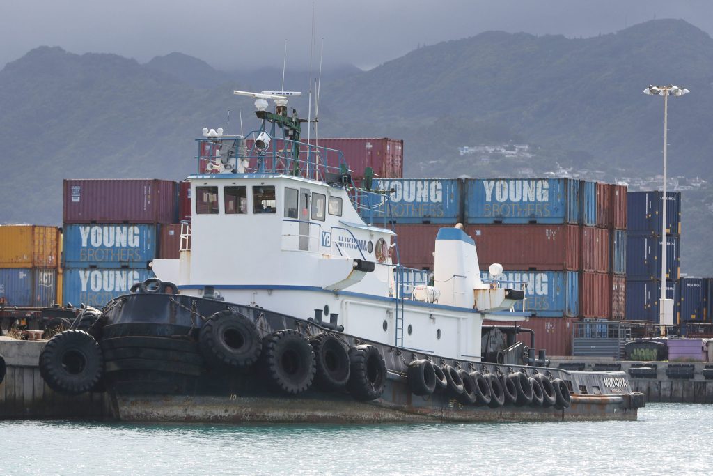 Young Brothers Tugboat Mikiona sits dockside in Honolulu Harbor.