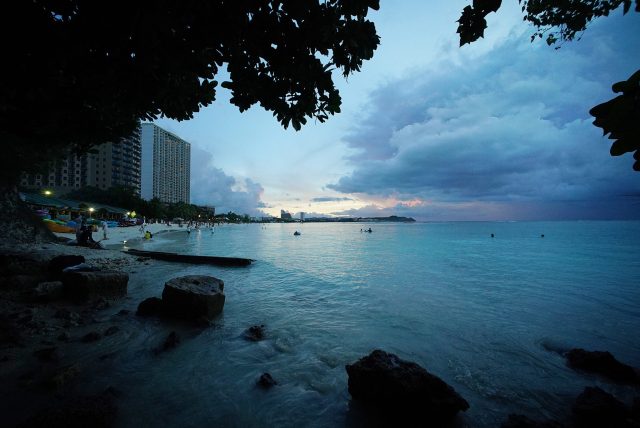 Rain clouds sit on the horizon offshore Guam’s Tumon Bay, one of Guam’s major tourist centers on the island.