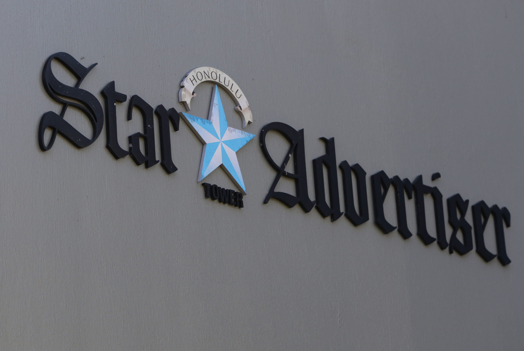 Honolulu Star Advertiser sign on the Restaurant Row building.