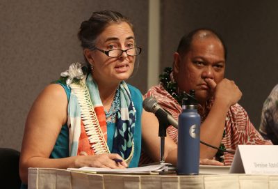 Moderator Hawaii Energy Forum keynote panel members left, Denise Antolini and right, Leo Asuncion at the Capitol.