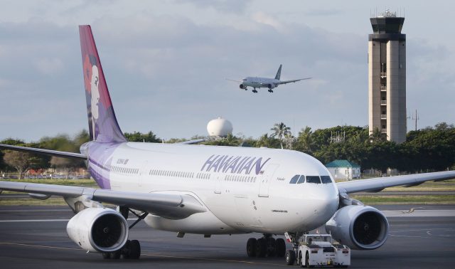Hawaiian Airlines Airbus A300-200 is moved to takeoff from Daniel K. Inouye International Airport.