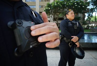 Right, HPD officer Joelyn DeCaires stands w/ left colleague Sgt. Henry Roberts at a HPD press conference announcing 35 officers in downtown are using cameras on a daily basis. 13 aug 2018