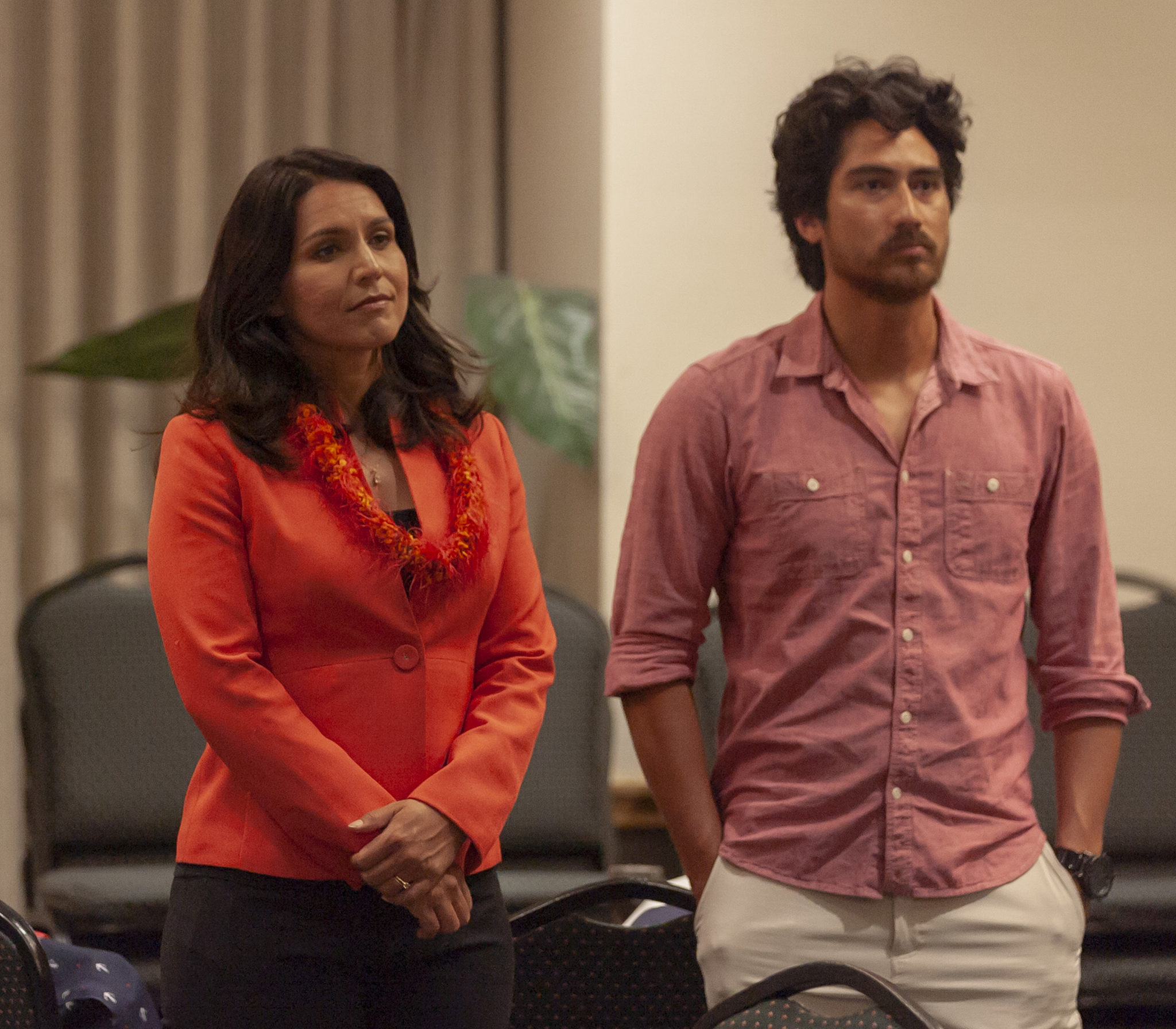 U.S. Rep. Tulsi Gabbard and her husband Abraham Williams looks on as Hawaii Democratic Gubernatorial candidate Colleen Hanabusa thanks her supporters at her election night headquarters in the Japanese Cultural Center, Saturday, Aug. 11, 2018, in Honolulu.