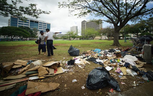 Piles of trash at Aala Park today along King Street with homeless tents and structures.