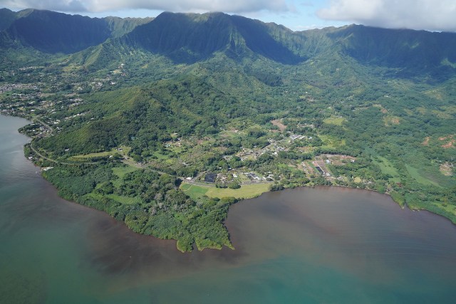 Kaneohe Bay Kahaluu Windward oahu reef aerial with what looks like some soil runoff polution along the shoreline.