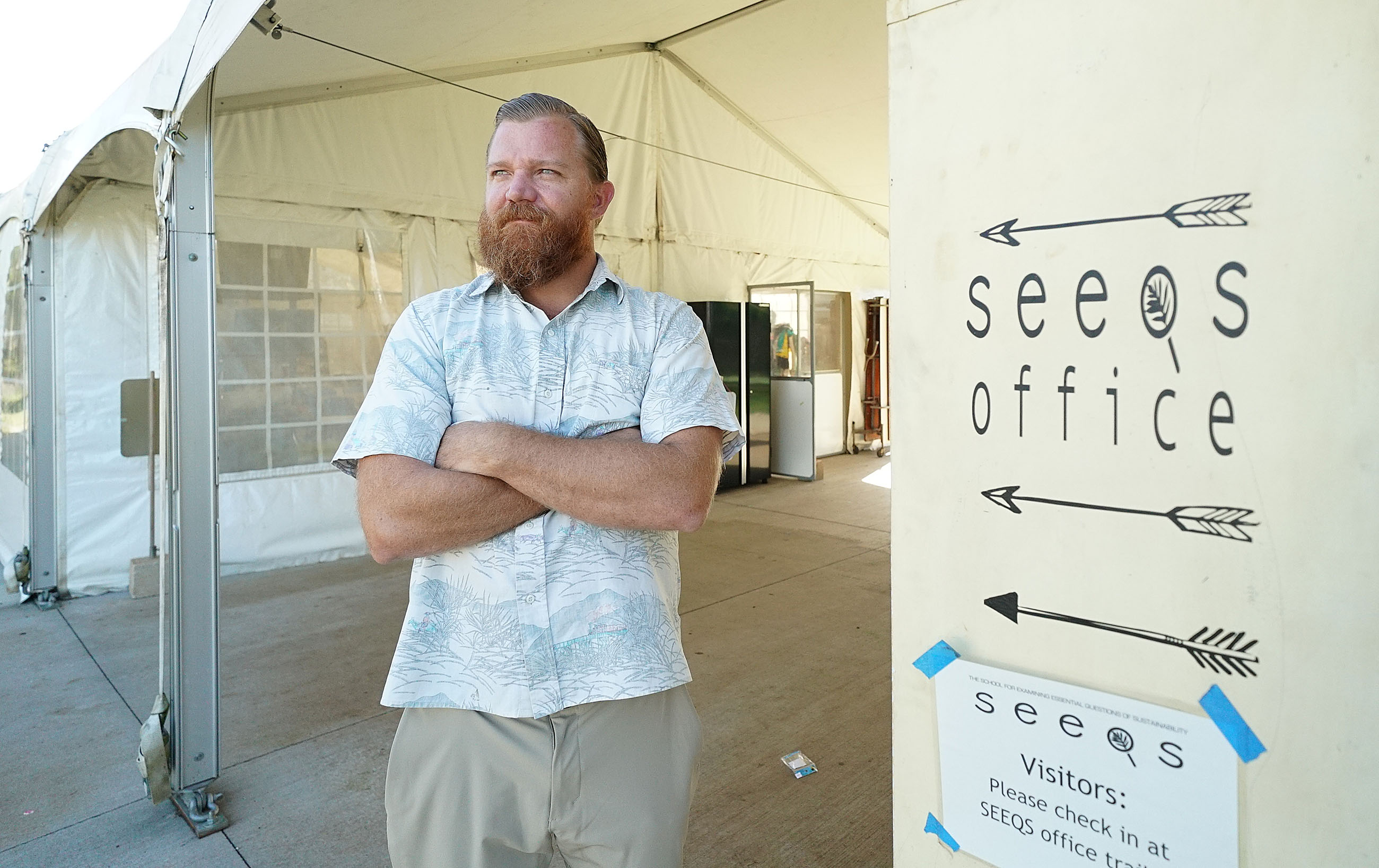 SEEQ Teacher Shane Albritton at Kaimuki High School SEEQ tent in background.