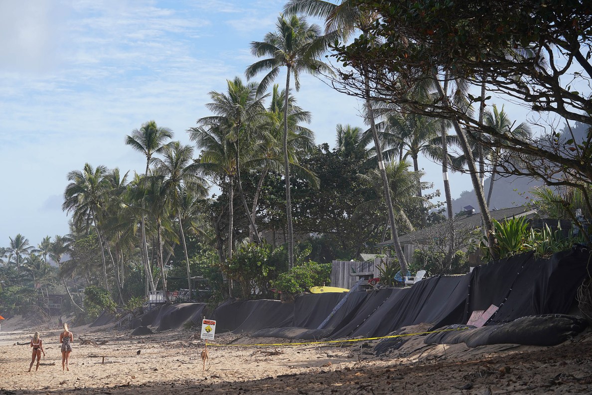 Beach front properties near Ehukai Beach with black material to protect erosion.