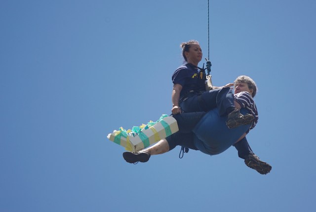 Honolulu Fire Department Rescue Personnel airlifted injured person to an awaiting ambulance at Manoa Recreation Center.