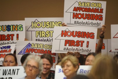 Sign holders in support of Bill 85 & 89 at the Honolulu City Council.