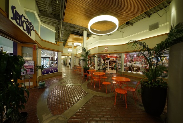 Shopping area at Ward Centre, open seating with no one seated, quite empty.