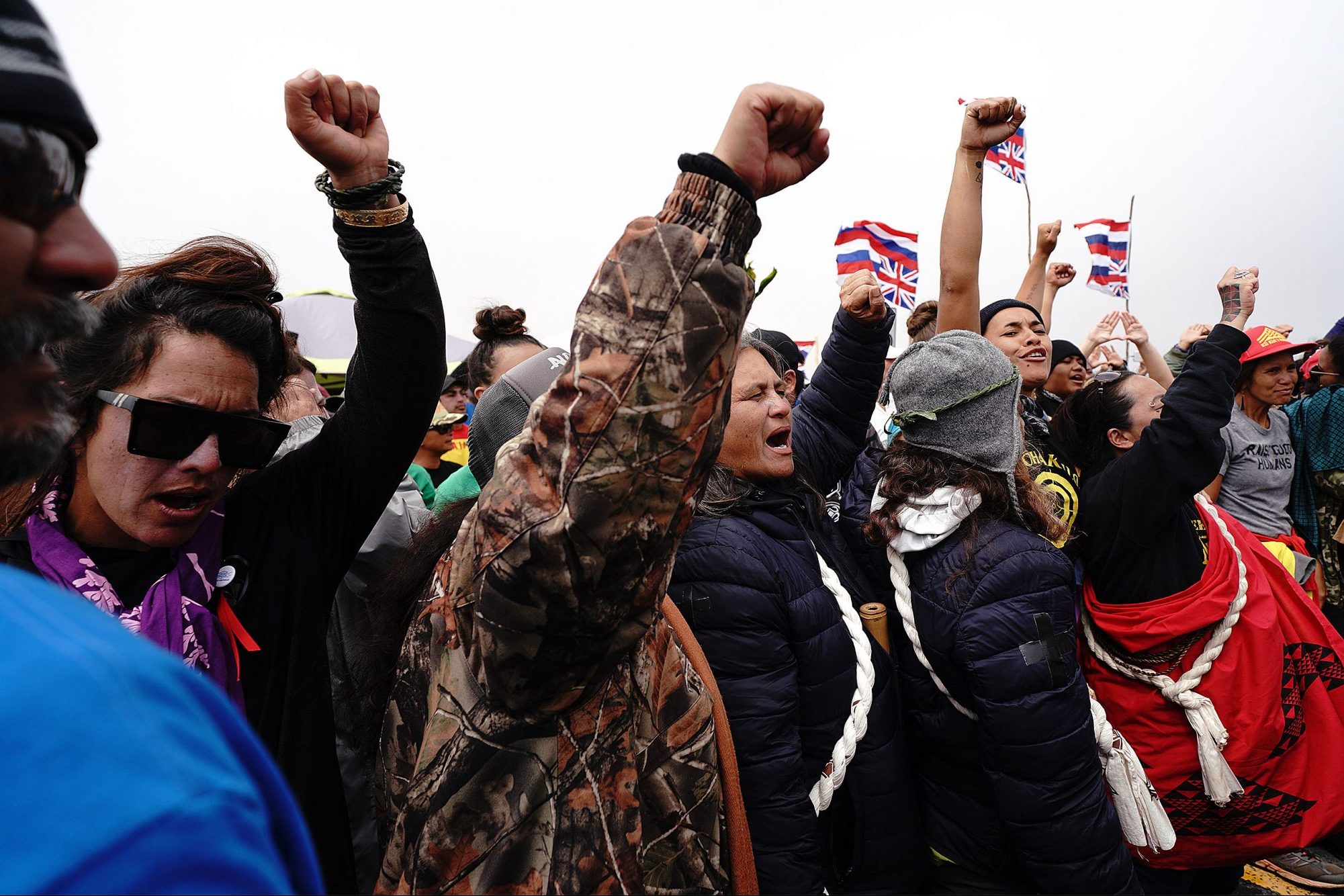 TMT Wahine Demonstrators cheer after law enforcement left, after negotiations over moving some unattended vehicles on the Saddle Road. July 17, 2019