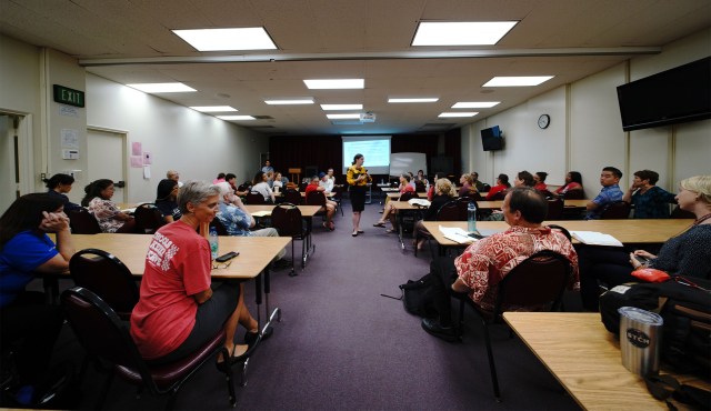 Senior Associate Amanda Brown asks questions during DOE Teacher Salary session held at McKinley Adult School.