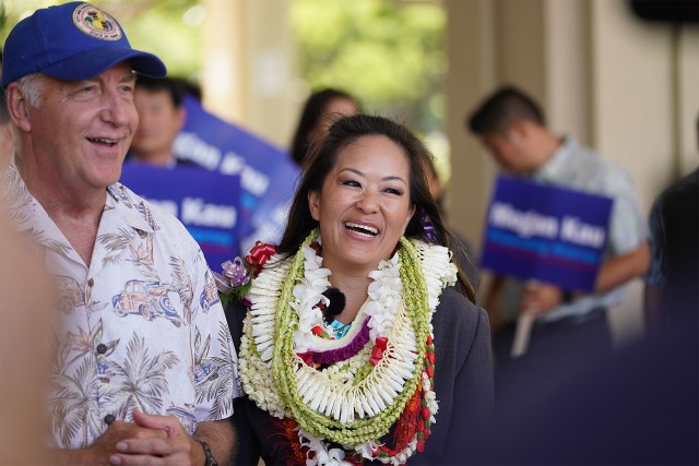 Attorney Megan Kau announces her candidacy for Honolulu city prosecutor with Peter Carlisle outside Circuit Court building.