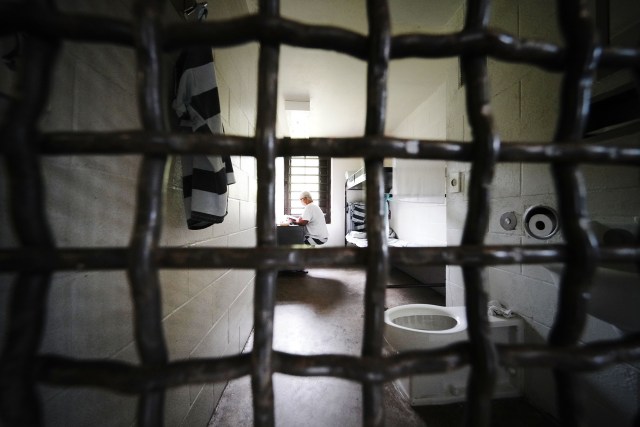 Elderly inmate sits in cell at Halawa Correctional Facility in module during tour 2019 tour.