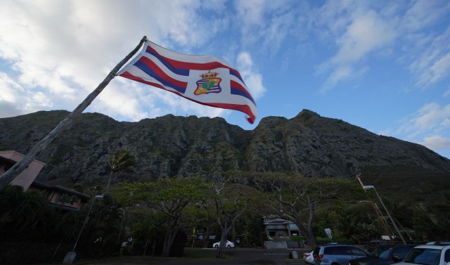 Flag flies at Kaiona Beach Park with the majestic Koolau Mountains near Waimanalo.