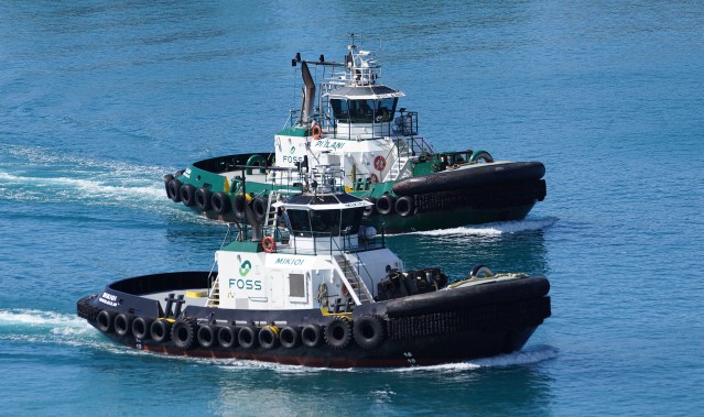 Foss tugboats bottom of photograph, Mikioi and top, Piilani at Honolulu Harbor.