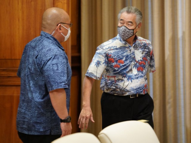 Governor David Ige enters ceremonial room wih mask on before Coronavirus COVID-19 press conference. April 8, 2020.