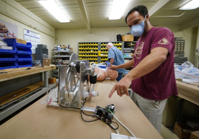 Olin Lagon points to the Ventilator’s intervalometer portion of the machine while at Bear Machinery in Kaneohe.