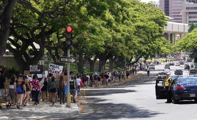 Black Lives Matter marchers walk towards the Capitol along Beretania Street after marching from Ala Moana Beach Park.