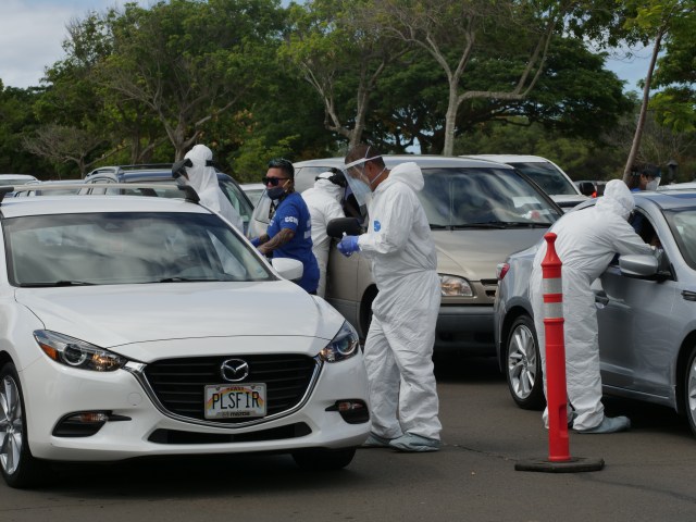 Volunteers were kept busy performing COVID-19 testing at the Waipi'o Peninsula Soccer Complex Saturday, June 27, 2020. Dr. Scott Miskovich continues to lead the Premier Medical Group Hawaiʻi in COVID testing as the State is experiencing a recent rise in positive cases. (Ronen Zilberman photo Civil Beat)
