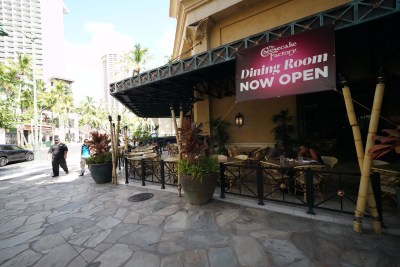 Cheesecake Factory located in Waikiki during COVID-19 pandemic. Sign reads, ‘Dining Room Now Open’ during pandemic. July 10, 2020