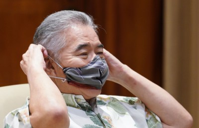 Governor David Ige adjusts his mask during press conference announcing a spike of 41 new cases of COVID-19. July 7, 2020