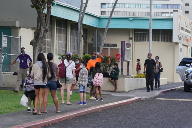 Kauluwela Elementary School students and parents arrive for first day of in person instruction during a COVID-19 pandemic. August 17, 2020