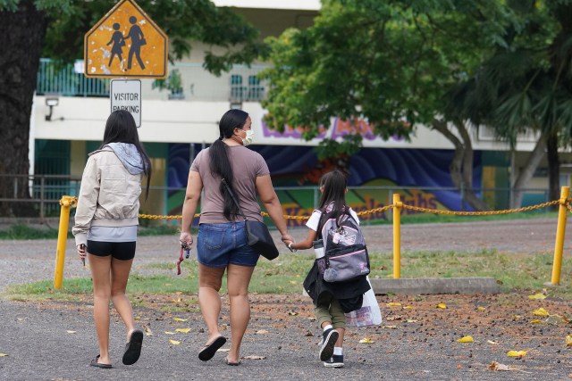 Kauluwela Elementary School studentsand parents arrive on first day of in person instruction during a COVID-19 pandemic. August 17, 2020