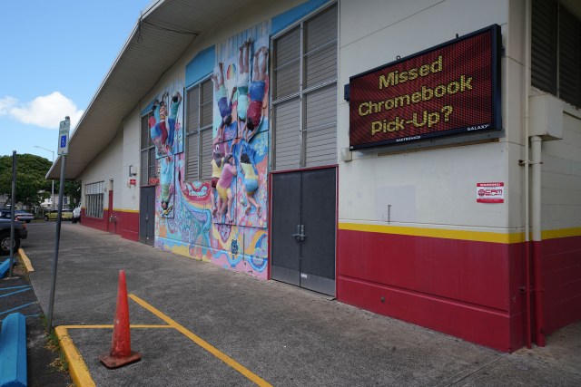 Kawananakoa Middle School electronic sign asks about Chromebook pickup during COVID-19 pandemic. August 13, 2020