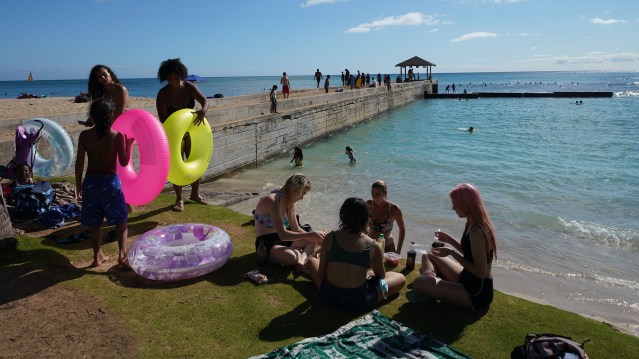 People gather near the Kapahulu Groin in Waikiki. Aug, 6 - Following a continued surge of COVID-19 cases and deaths, Mayor Caldwell’s Emergency Order 2020-23 includes the closure of City parks, most park facilities, all campgrounds, Botanical Gardens, and Community Gardens from Saturday, August 8 through Friday, September 4, 2020.