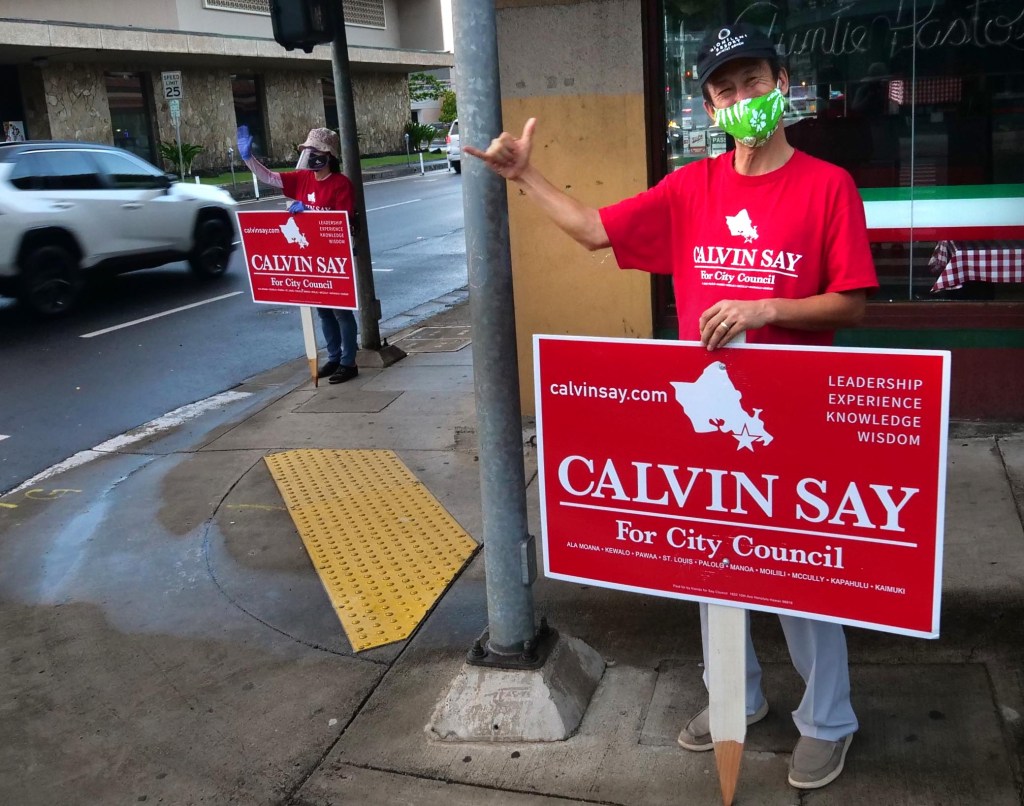 Sign wavers on Beretania and Pensacola in Honolulu, HI, Friday, August 7, 2020. (Ronen Zilberman photo Civil Beat)