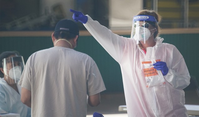 Medical personnel assist with surge COVID-19 testng held at Aloha Stadium. September 4, 2020