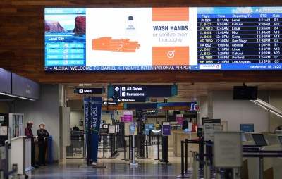 Electronic signs telling people to ‘wash your hands’ at the Daniel K. Inouye International Airport Interisland terminal during COVID-19 pandemic. September 18, 2020