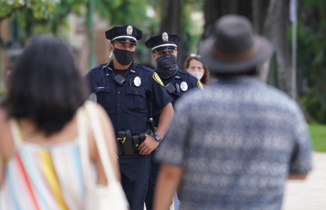 HPD Honolulu Police officers patrol along Kalakaua Avenue during COVID-19 pandemic. October 28, 2020