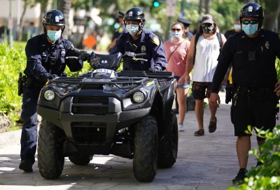 HPD Honolulu Police officers move ATV Quad / 4 wheeler outside the Waikiki substation.