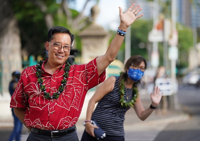 Mayoral Candidate Keith Amemiya and wife Bonny Amemiya wave at cars while campaigning along King Street. October 12, 2020
