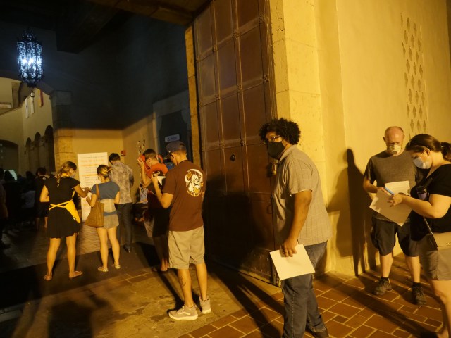 Voters continue waiting in long lines to cast their ballots at the Honolulu Hale after dark on Election Day Tuesday, November 3, 2020. (Ronen Zilberman photo Civil Beat)