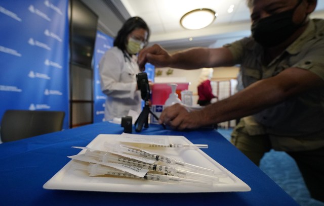 Dose #1 of Pfizer-BioNTech COVID-19 vaccine in syringes during press event held at Queen's Medical Center. December 15, 2020
