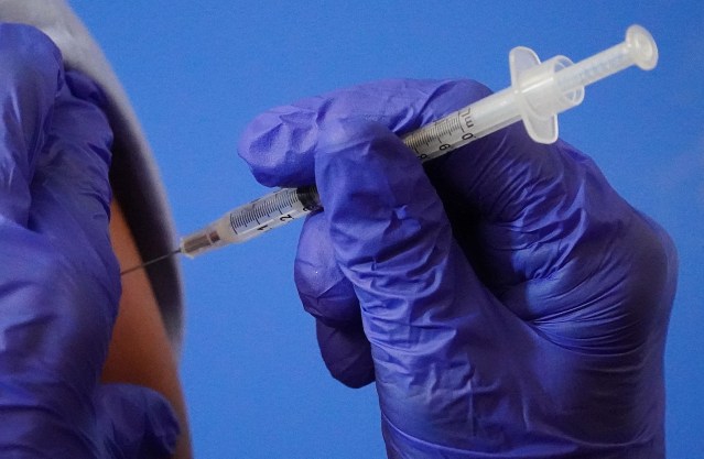 Dose #1 of Pfizer-BioNTech COVID-19 vaccine in syringe during press event held at Queen's Medical Center. December 15, 2020