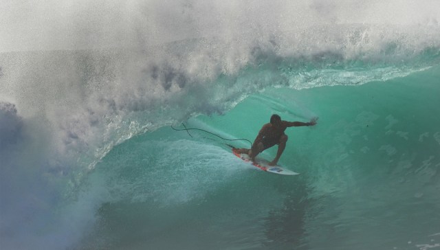 Surfer enjoys waves at Pipeline during the first winter swell of the season.